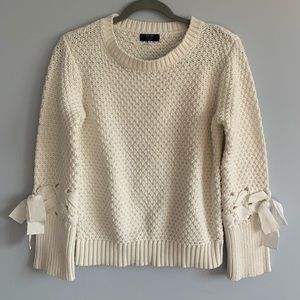 Knit sweater with lace designs sleeves